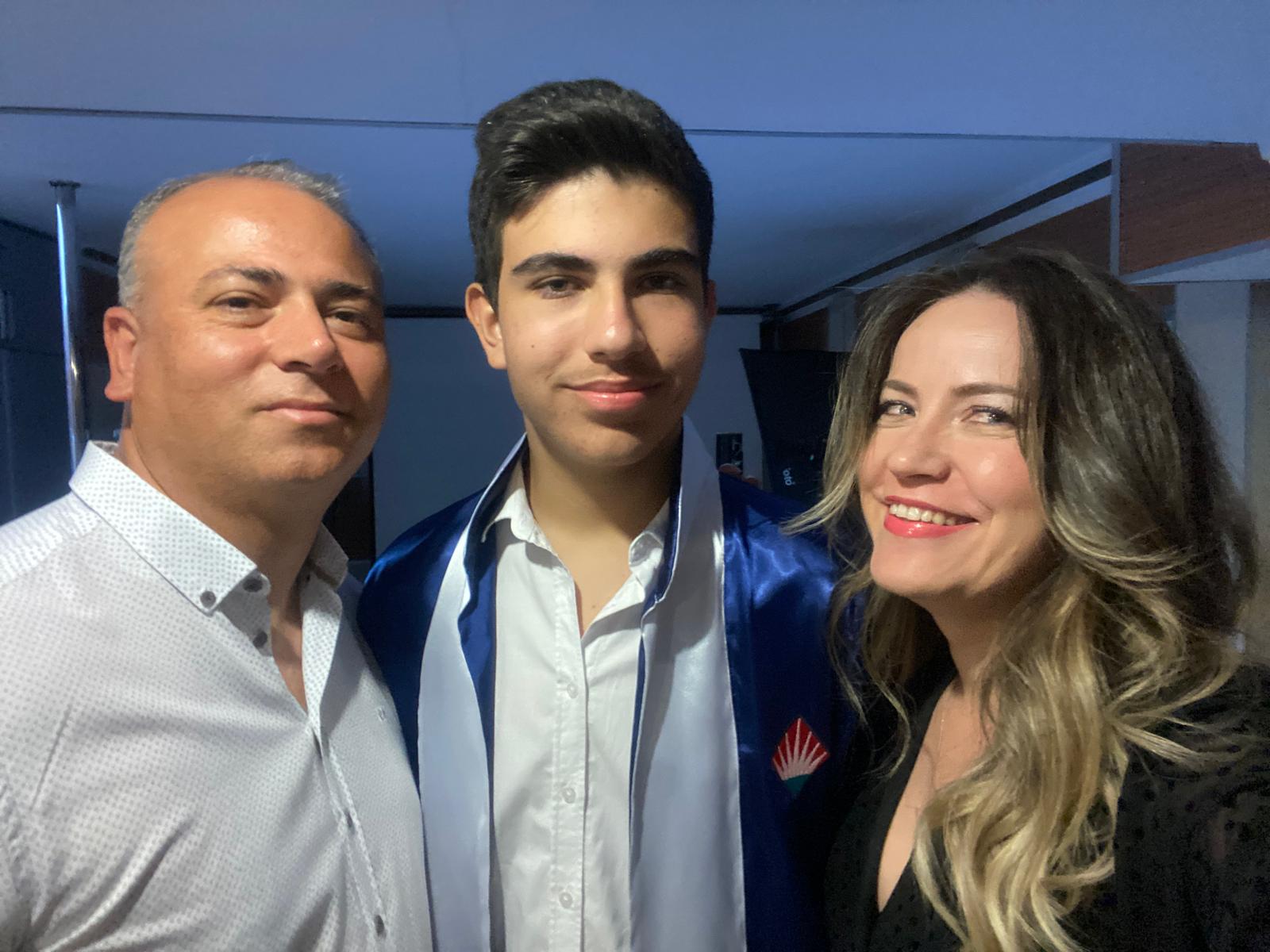 A photo with my mom and dad at the Bahcesehir College Middle School graduation.